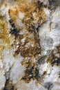 White rock with yellow discoloration