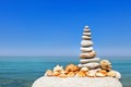 White rock Zen against the background of summer sea and blue sky. Concept of balance, harmony and meditation Royalty Free Stock Photo