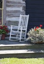 White rocker on a wood porch Royalty Free Stock Photo