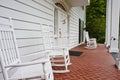 White Rockers on Red Tile Porch