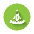 White Rocket icon isolated with long shadow. Green circle button. Vector