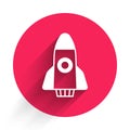White Rocket ship icon isolated with long shadow background. Space travel. Red circle button. Vector Royalty Free Stock Photo