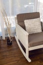 White rocking chair with brown cushion in the interior Royalty Free Stock Photo