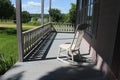 Rocking Chair on a 1850`s House Porch Royalty Free Stock Photo