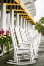 White Rocking Chairs on Long Porch Royalty Free Stock Photo