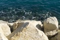 White rocky cliff and blue sea below Royalty Free Stock Photo