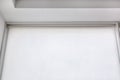 White rolled textile blinds on the window in a room. Royalty Free Stock Photo