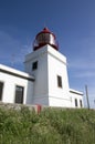 White romantic lighthouse on the cliff, west Madeira island, village Ponta do Pargo, Portugal, Atlantic ocean Royalty Free Stock Photo