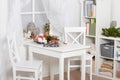 White room interior with christmas decoration, window, table and chair Royalty Free Stock Photo