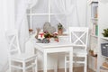 White room interior with christmas decoration, window, table and chair Royalty Free Stock Photo