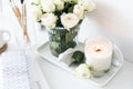 White room interior decor with burning hand-made candle and bouq Royalty Free Stock Photo