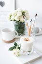 White room interior decor with burning hand-made candle and bouq Royalty Free Stock Photo