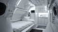 White room with single bed in spaceship, interior design of starship or space station. Compartment for crew or passengers in