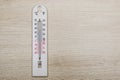 White room thermometer on wooden background Royalty Free Stock Photo