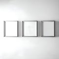 White room with three frames on the wall