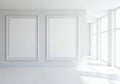 A white room with two empty picture frames on the wall Royalty Free Stock Photo