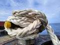 white rope with a binding fiber that binds on the boat 20