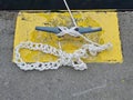 White Rope With Chain Sinnet Knot On Dock Cleat Royalty Free Stock Photo