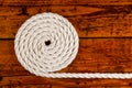 White Rope Coiled on Textured Wood Royalty Free Stock Photo