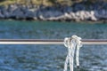 White rope on railing of boat Royalty Free Stock Photo