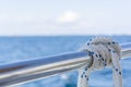 White rope on railing of yacht boat Royalty Free Stock Photo