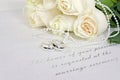 White rose bouquet and wedding rings Royalty Free Stock Photo