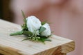 White rose boutonniere for wedding formal wear Royalty Free Stock Photo