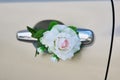 White rose flower on the handle of a car in wedding day Royalty Free Stock Photo