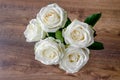 White rose flowers on a wooden background, vintage toned Royalty Free Stock Photo