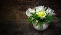 White rose, green carnation, white chamomile decorated on dark tone wooden