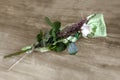 White rose lays on the wooden table top