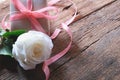 White rose and minimal gift box on vintage wooden table. Lover concept. Perfect for Valentine& x27;s background Royalty Free Stock Photo