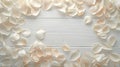 White rose petals scattered on a white surface of wooden planks Royalty Free Stock Photo