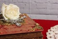 White Rose on Antique Book With Crystal Rhinestone Necklace Royalty Free Stock Photo