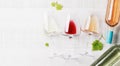 White, rose and red wine glasses and bottles Royalty Free Stock Photo