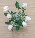 White roses with green leaves in a glass vase with water Royalty Free Stock Photo