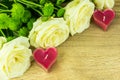 White roses with heart candles Royalty Free Stock Photo