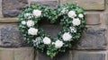 White Roses Heart Shaped Wreath On Stone Wall Royalty Free Stock Photo