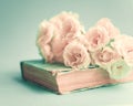 White roses over book Royalty Free Stock Photo