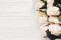 White roses on wooden background, copy space for text. Floral gr Royalty Free Stock Photo