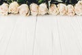 White roses on wooden background, copy space for text. Floral gr Royalty Free Stock Photo