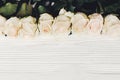 White roses on wooden background, copy space for text. Floral gr Royalty Free Stock Photo