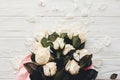 White roses on wooden background, flat lay with space for text. Royalty Free Stock Photo