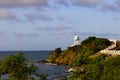 White rotunda on a cliff by the ocean at sunset