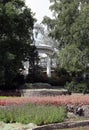 white rotunda in the park between the trees. small architectural forms