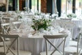 The white round banquet tables in the restaurant. Stylish event decor Royalty Free Stock Photo