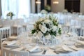 The white round banquet tables in the restaurant. Stylish event decor Royalty Free Stock Photo