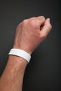 White round bracelet on hand, mockup. Arm wristband accessory adhesive blank