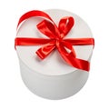 White round cartoon gift box with red bow isolated on white background Royalty Free Stock Photo