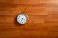 white round clock on wooden floor.Round classic clock lying on a wooden flooring or wooden wall Royalty Free Stock Photo